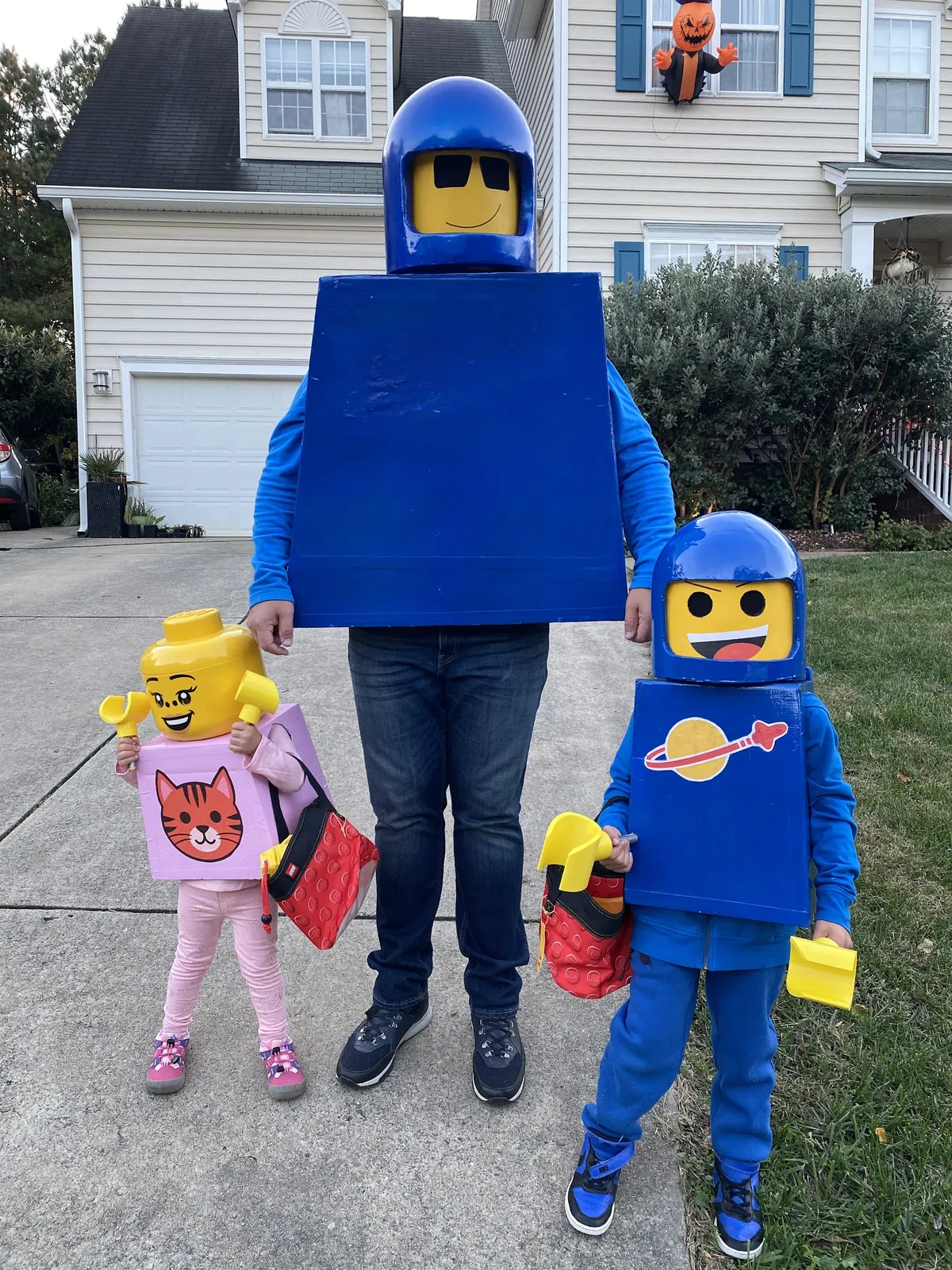 Keno Vigil and his kids in handmade LEGO spaceman Halloween costumes